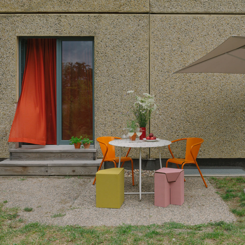 RIAB cardboard stool yellow and pink on terrace