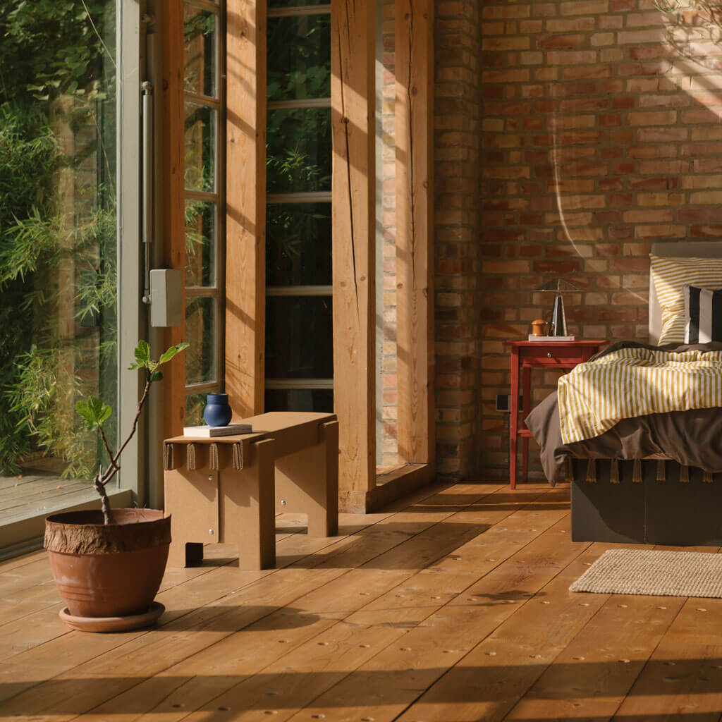 RIAB sustainable cardboard GRID bench near window in bedroom