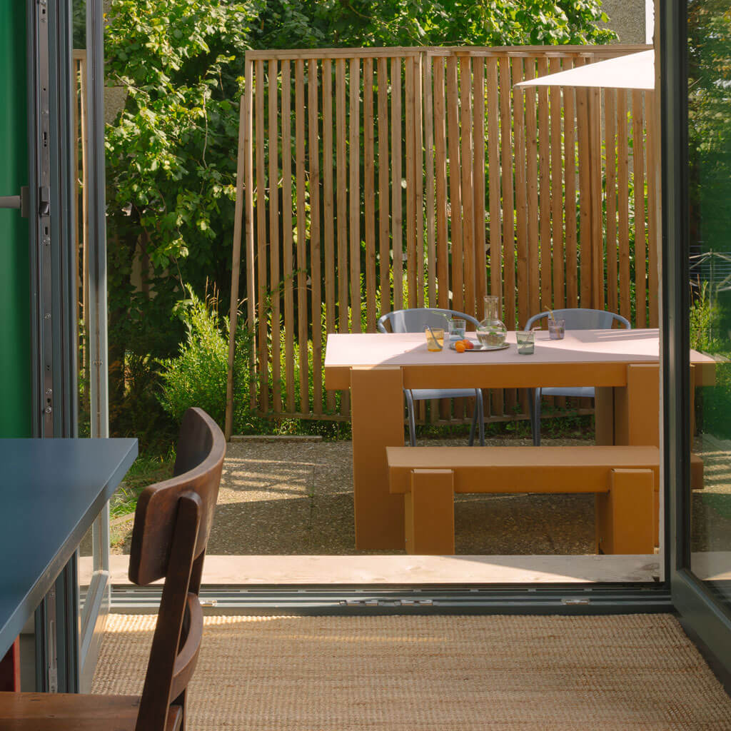 RIAB sustainable cardboard GRID bench at dining table on terrace