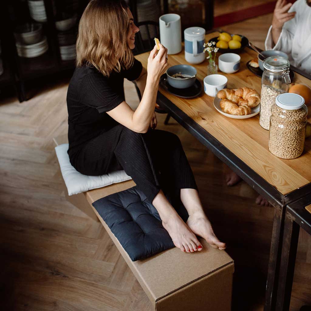 sustainable cardboard bench at the dining table