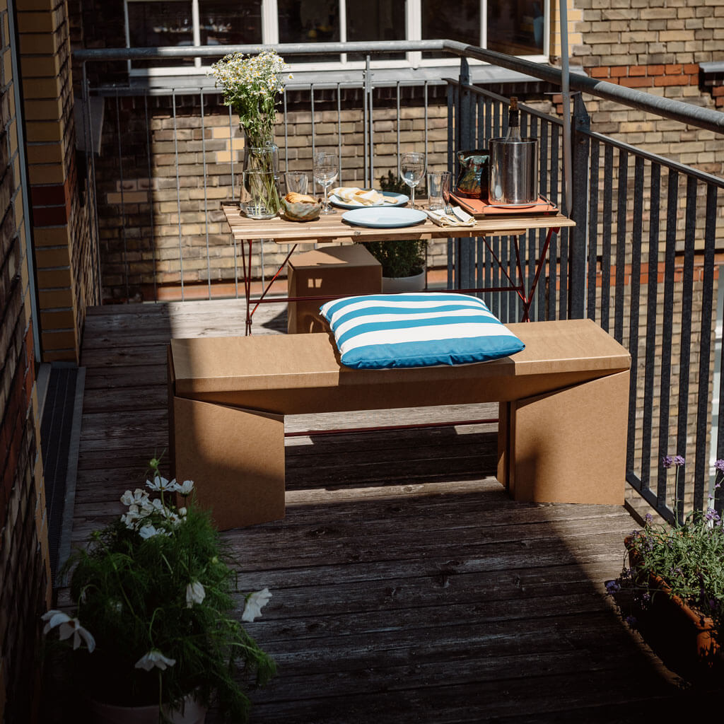 sustainable cardboard bench on balcony